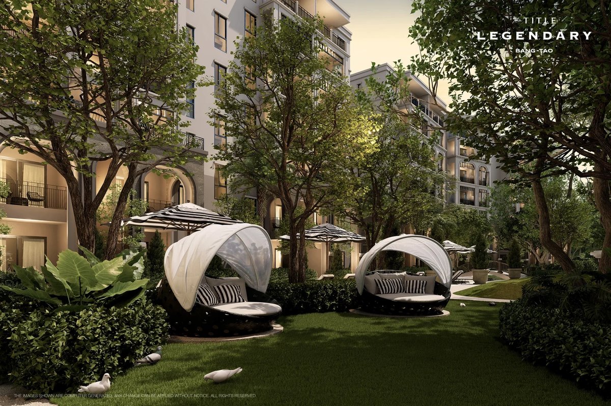 The Title Legendary — poolside daybeds in the garden